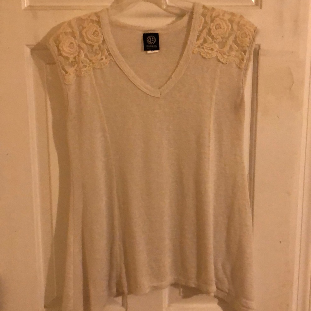 Sheer tank with shoulder details.